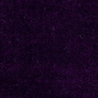 Purple velvet fabric texture with a dense pile and subtle nap variation, displaying a rich, dark hue and tactile fiber quality.
