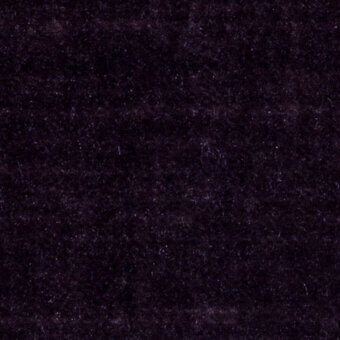 Purple velvet fabric texture with a dense pile, subtle fiber variations, and interspersed silver flecks creating a soft, shimmering effect.