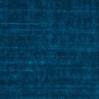 Teal velvet fabric sample displaying a dense, short pile texture with horizontal striations and a matte finish, evenly lit against a teal background.