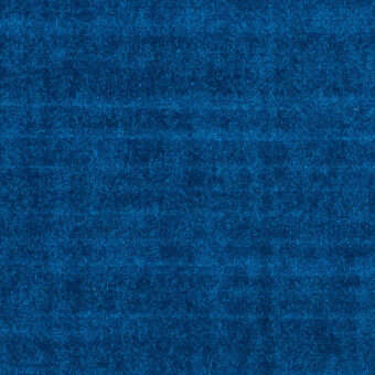 Blue velvet fabric sample displaying horizontal striations and a dense, short pile with subtle tonal shifts in color and texture.