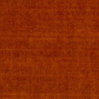 Velvet fabric sample, orange-brown color, dense short pile with subtle mottled texture and indistinct raised pattern.