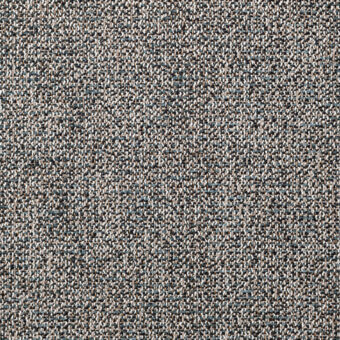Gray woven fabric texture, speckled granular surface with blue and brown tones, nubby quality suitable for upholstery applications.