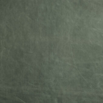 Olive-green leather texture sample with mottled markings, faint scratches, and a slight sheen; includes “borzalino” material designation text.