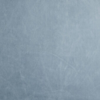 Blue leather texture with mottled grain and irregular lines, displaying a distressed, granular surface suitable for upholstery applications.