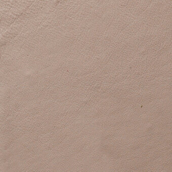 Light beige leather texture displaying a fine, pebbled grain pattern with subtle tonal variations and matte finish; product code visible.