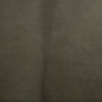 Dark brown vegetable-tanned leather with a textured grain and subtle color variation, displaying creases and a vertical seam.