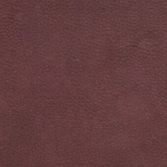 Reddish-brown leather texture with granulated surface, displaying irregular bumps and crevices, creating a dense, matte, and tactile appearance.