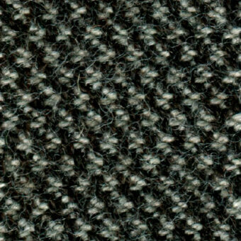 Charcoal gray woven fabric texture with heathered effect, displaying looped pile construction and fiber knots, labeled “bross > fabric (b) molly > col. 194”.