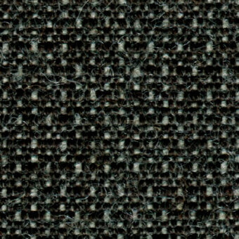 Dark charcoal gray tweed fabric texture with heathered effect, dense weave, visible yarns, and subtle brown fibers; fabric sample labeled “molly col. 196”.
