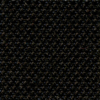 Dark charcoal fabric texture, “steelcut trio col. 195,” displays a dense, nubby weave with a matte finish and subtle tonal variations.