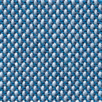 Woven fabric texture, blue, gray, and lavender yarns, tight grid pattern, durable construction, “steelcut trio col. 733” label visible.