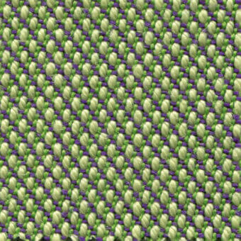 Woven fabric texture, green and purple threads, dense grid pattern with knotted yarn intersections, muted yellowish-green and deep purple tones.