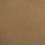 Distressed leather texture sample, medium brown with granular mottling, finely pebbled surface and subtle tonal variations, studio setting.