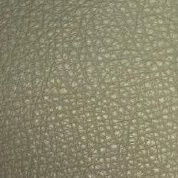 Leather texture swatch, light olive-green, pebbled grain with matte finish and faint “cprn homood” text at the bottom.
