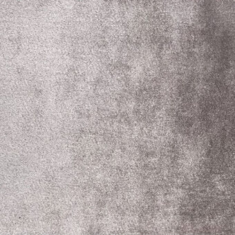 Gray velvet fabric texture displaying a short, dense pile with uneven light reflection and a matte, brushed surface.