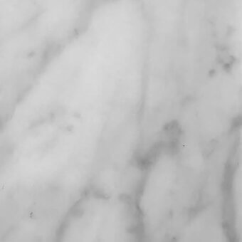 Carrara marble texture with white base and flowing grey veining, polished finish reflecting light, displaying organic patterns.