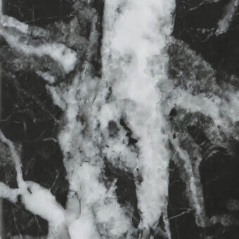 Statuario black marble texture with white veins, glossy finish, and irregular patterns on a smooth black background.