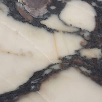 Medicea marble texture, white and gray veined, polished surface displaying organic patterns with purple and pink accents, crystalline structure.
