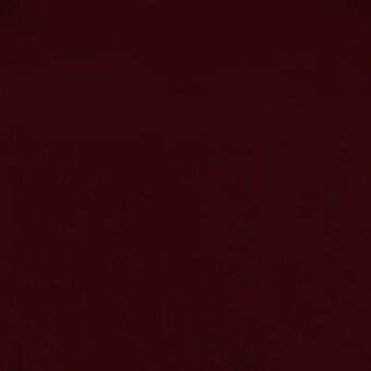 Cardinal red nubuk texture with a matte finish, displaying a granular surface and subtle tonal gradient from top to bottom.