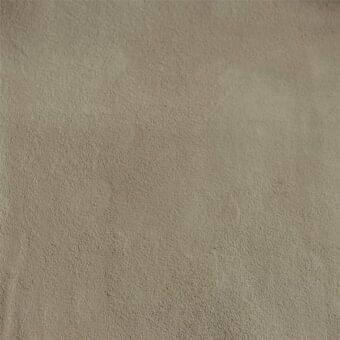 Muted sand-tone texture sample, granular matte finish, uniformly speckled surface resembling dense fabric with subtle gray undertones.