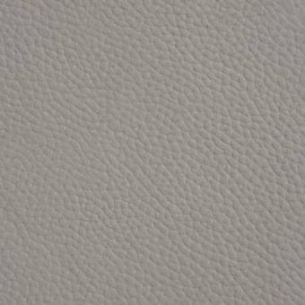 Light gray pebbled leather texture with fine-grained, rounded bumps and a matte finish, displaying subtle shading and dimensional depth.