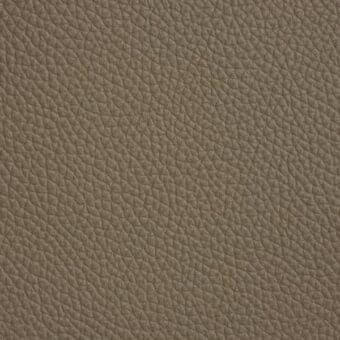 Cattelan Italia Soft Leather 942, model 1658, displays a textured, fango-colored surface with irregular bumps and a subtle sheen.