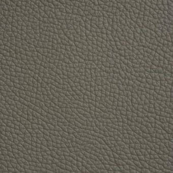 Soft leather texture in argilla color 983, displaying a dense grain with irregular bumps and a matte, earthy gray finish.
