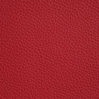 Soft leather texture, rosso corsa red, finely grained full-grain surface with uniform color and subtle tonal variation, Cattelan Italia 989 model.