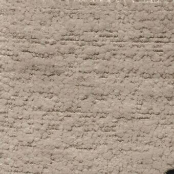 Beige karma bouclé 29 fabric sample displaying looped pile texture, horizontal lines, and warm neutral tonal variations.