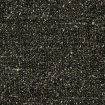 Agamotto fabric texture, dark charcoal gray, densely woven with heathered flecks, irregular nubby surface, cierre1972 collection.