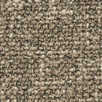 Neutral tweed fabric texture with dense, irregular weave in beige, tan, and brown tones; organic, nubby surface with subtle color flecks.