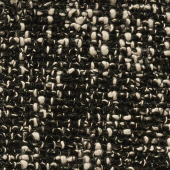 Black and off-white tweed fabric texture with a dense, speckled weave and nubby surface; matte finish from the cierre1972 funky collection.