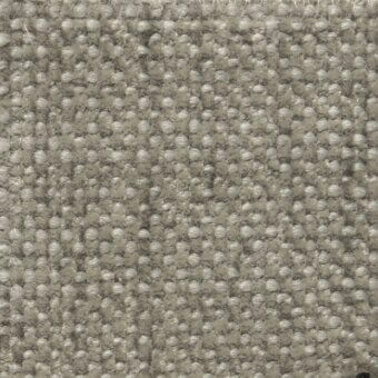 Gray woven fabric texture with speckled heathered effect, raised circular weave, and visible “cierre1972” product tag detail.