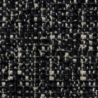 Navy and beige lucinasco tweed fabric displaying a small-scale herringbone pattern with a raised, nubby texture from the cierre1972 collection.