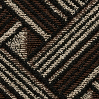 Woven fabric texture, geometric pattern in brown, cream, and black, diagonal lines and stepped shapes, tight weave, matte finish, cierre1972.
