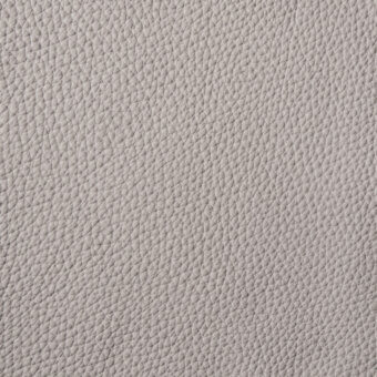 Light gray pebble-grain leather texture with a repeating pattern of small bumps and indentations, exhibiting a matte finish and subtle tonal variations.