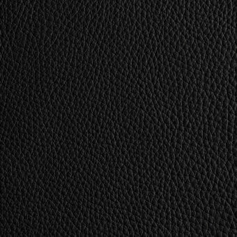Black leather texture displaying a dense, granular pebble-grain pattern with subtle tonal variations and an even, studio lighting scheme.