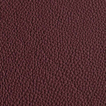 Burgundy leather texture with repeating geometric triangular pattern, full-grain finish, matte surface, and natural color variations.