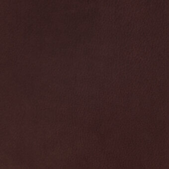 Brown nubuck leather texture with a granular surface, mottled pattern, and matte finish displaying warm chocolate tones and natural hide variations.