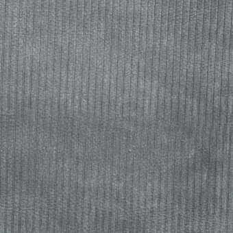 Gray leather texture with vertical ribbing, displaying a stamped linear pattern and subtle tonal variations across a slightly worn surface.