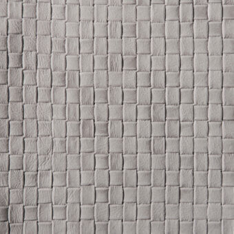 Gray leather texture with a quilted grid pattern, displaying a matte finish and subtle tonal variations across a natural grain surface.