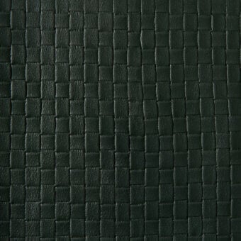 Dark green leather texture with a square grid pattern, matte finish, and subtle grain; “stampa quadri” product identifier visible.
