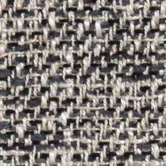 Woven tweed-like fabric texture with light beige and dark gray heathered yarns in a dense, irregular diagonal grid pattern.