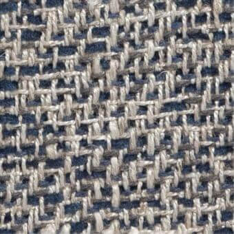 Woven tweed-like fabric with muted navy blue and light beige yarns in an irregular, dense structure; includes “costantini pietro” label.