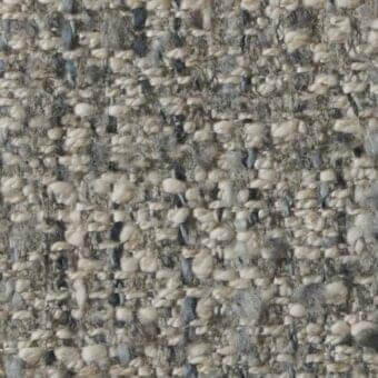 Beige tweed fabric sample with gray and blue flecks, dense woven texture, vertical and horizontal threads, matte finish.