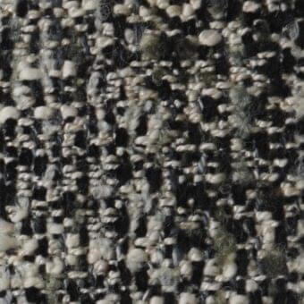 Costantini Pietro m46 fabric, black, cream, and olive tweed texture with knotted weave and granular, raised surface.