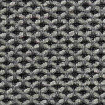Geometric textile sample, gray and off-white yarns, dense honeycomb weave with interlocking circles and squares, “m61” Constantini Pietro fabric.