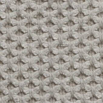 Woven fabric texture, light gray geometric pattern, repeating diamond shapes with raised grid structure, matte finish, linen or cotton appearance.