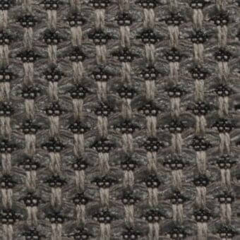 Woven fabric texture, muted gray and charcoal geometric pattern, grid structure with raised circular nodes, natural beige threads visible.