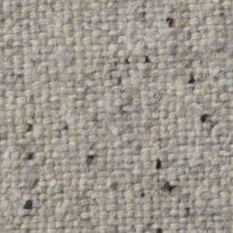 Costantini Pietro n02 fabric, light beige tweed texture, dense irregular weave with gray, black, and yellow flecks, matte finish.